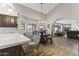 Kitchen with island seating, hardwood floors, and views to living room at 1848 E Mallory St, Mesa, AZ 85203