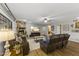 Comfortable living room features a fireplace, hardwood floors, and leather sofas at 1848 E Mallory St, Mesa, AZ 85203