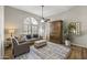 Open living room with hardwood floors, neutral tones, and ample natural light at 1848 E Mallory St, Mesa, AZ 85203