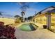 Stunning kidney shaped pool with patio and lush landscaping at 1848 E Mallory St, Mesa, AZ 85203