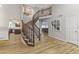 Elegant curved staircase with wood railings and hardwood floors at 1848 E Mallory St, Mesa, AZ 85203