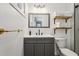 Modern bathroom with gray vanity, floating shelves, and walk-in shower at 1965 E Laguna Dr, Tempe, AZ 85282