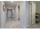 Bright hallway with tile flooring and linen closet at 19841 W Montecito Ave, Litchfield Park, AZ 85340