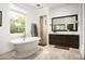 Luxurious bathroom with a freestanding tub, dual sinks, and a walk-in shower at 19878 N 102Nd St, Scottsdale, AZ 85255