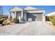 Single-story home with gray garage door and stone accents at 2034 E Dry Wood Rd, Phoenix, AZ 85024