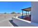 Covered patio with table, chairs, and desert landscape views at 212 E Nebraska St, Florence, AZ 85132