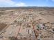 Aerial view of a single-story home on a large lot with a detached building at 21335 W Cavalry Dr, Wittmann, AZ 85361