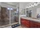 Double vanity bathroom with a large walk-in shower at 21335 W Cavalry Dr, Wittmann, AZ 85361