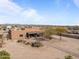 Ranch-style home with covered patio and desert landscaping at 21335 W Cavalry Dr, Wittmann, AZ 85361