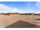 Large sand parking area with covered shelter at 21335 W Cavalry Dr, Wittmann, AZ 85361