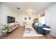 Bright living room with a comfy couch and wood floors at 2329 N Evergreen St, Phoenix, AZ 85006