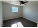 Spacious bedroom with hardwood floors and a ceiling fan at 236 S 2Nd St, Avondale, AZ 85323