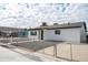 Newly renovated home with a fresh white exterior and a well-maintained front yard at 236 S 2Nd St, Avondale, AZ 85323