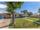 House exterior featuring a large tree and spacious yard at 2549 W Montebello Ave, Phoenix, AZ 85017