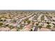 Aerial view showcasing a neighborhood with houses and solar panels at 26645 N 42Nd St, Cave Creek, AZ 85331