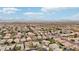 Aerial view of neighborhood with houses, pools, and distant mountains at 26645 N 42Nd St, Cave Creek, AZ 85331