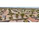 Aerial view of neighborhood with houses, solar panels, and mountain views at 26645 N 42Nd St, Cave Creek, AZ 85331