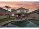 Home features a backyard with a pool and patio furniture, perfect for entertaining at 26645 N 42Nd St, Cave Creek, AZ 85331