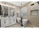 Elegant bathroom with double vanity, freestanding tub, and walk-in shower at 26645 N 42Nd St, Cave Creek, AZ 85331