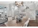 Spacious dining room with a rustic wood table and chandelier at 26645 N 42Nd St, Cave Creek, AZ 85331