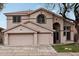 Two-story house with a three-car garage and neutral color scheme at 26645 N 42Nd St, Cave Creek, AZ 85331