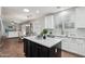 Spacious kitchen with island, white cabinets, and stainless steel appliances at 26645 N 42Nd St, Cave Creek, AZ 85331