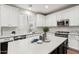 Modern kitchen featuring white cabinets, subway tile backsplash, and a kitchen island at 26645 N 42Nd St, Cave Creek, AZ 85331