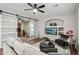 Spacious living room featuring a built-in entertainment center and barn doors at 26645 N 42Nd St, Cave Creek, AZ 85331