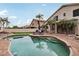 Inviting kidney-shaped pool surrounded by a brick patio at 26645 N 42Nd St, Cave Creek, AZ 85331