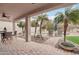 Relaxing patio with pool, wicker furniture, and palm trees at 26645 N 42Nd St, Cave Creek, AZ 85331