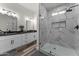 Bathroom with marble shower and double vanity at 28813 N 201St Ave, Wittmann, AZ 85361