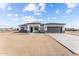 Single-story home with gray garage door and stone accents at 28813 N 201St Ave, Wittmann, AZ 85361