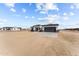 New construction home with gray garage door and stone accents at 28813 N 201St Ave, Wittmann, AZ 85361
