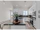 Modern kitchen with white cabinets and large island at 28813 N 201St Ave, Wittmann, AZ 85361