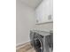 Bright laundry room featuring new washer and dryer at 28813 N 201St Ave, Wittmann, AZ 85361