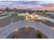 Stunning aerial view of a modern home with a circular driveway and beautifully landscaped yard at 2911 W Latona Rd # 1, Laveen, AZ 85339