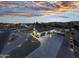 Aerial view of home with long driveway and beautiful sunset at 2911 W Latona Rd # 1, Laveen, AZ 85339