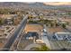 Aerial view showcasing a single-story home, expansive backyard, and surrounding neighborhood at 2911 W Latona Rd # 1, Laveen, AZ 85339