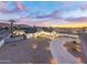Stunning aerial view of a home with a curved driveway and landscaped yard at 2911 W Latona Rd # 1, Laveen, AZ 85339