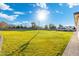 Large grassy backyard with plenty of space for outdoor activities and RV parking at 2911 W Latona Rd # 1, Laveen, AZ 85339