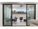 View of backyard through sliding glass doors; patio furniture included at 2911 W Latona Rd # 1, Laveen, AZ 85339