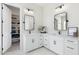Bathroom with double vanity, large mirrors, and walk-in closet at 2911 W Latona Rd # 1, Laveen, AZ 85339