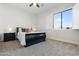 Comfortable bedroom with a black sleigh bed and window shutters at 2911 W Latona Rd # 1, Laveen, AZ 85339