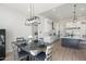 Modern dining area with gray table and chairs, open to kitchen at 2911 W Latona Rd # 1, Laveen, AZ 85339