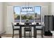 Bright dining area with mountain views and a wine refrigerator at 2911 W Latona Rd # 1, Laveen, AZ 85339