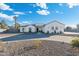 Modern farmhouse exterior with a paved driveway and landscaping during the day at 2911 W Latona Rd # 1, Laveen, AZ 85339
