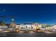 Modern farmhouse with a circular driveway and landscape lighting at night at 2911 W Latona Rd # 1, Laveen, AZ 85339