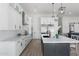 Modern kitchen with white cabinets, quartz countertops, and stainless steel appliances at 2911 W Latona Rd # 1, Laveen, AZ 85339