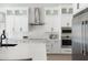 Modern kitchen with white cabinets, stainless steel appliances and quartz countertops at 2911 W Latona Rd # 1, Laveen, AZ 85339