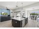 Open concept kitchen with large island, stainless steel appliances, and white cabinetry at 2911 W Latona Rd # 1, Laveen, AZ 85339